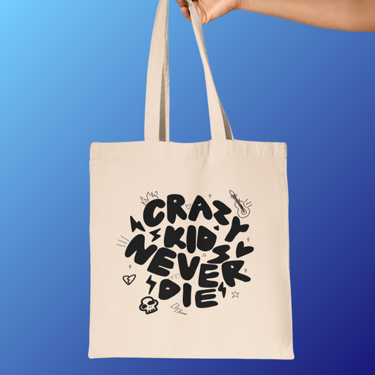 Fearnot holding Lesserafim tote bag featuring design of ‘Crazy kids never die’